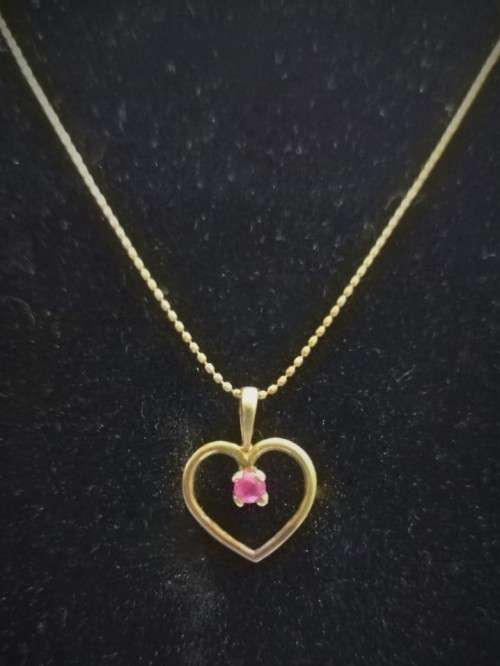Genuine `RUBY` Heart Pendant and Chain set in 9 Carat Solid Gold.