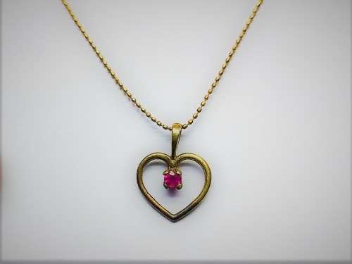 Genuine `RUBY` Heart Pendant and Chain set in 9 Carat Solid Gold.