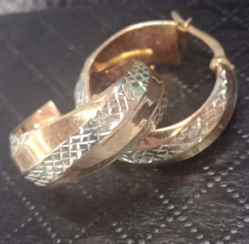 Designer `Diamond cut Design` earrings set in 9 Carat Yellow and White Hollow Gold.