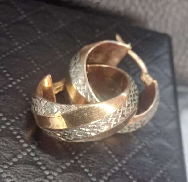 Designer `Diamond cut Design` earrings set in 9 Carat Yellow and White Hollow Gold.