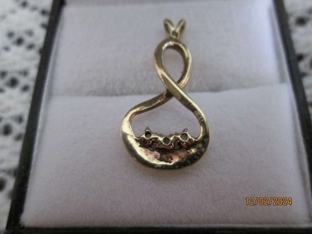 `INFINITY PENDANT` set with 3 X 0.05 Carat Natural Diamonds, set in 9ct Yellow Gold