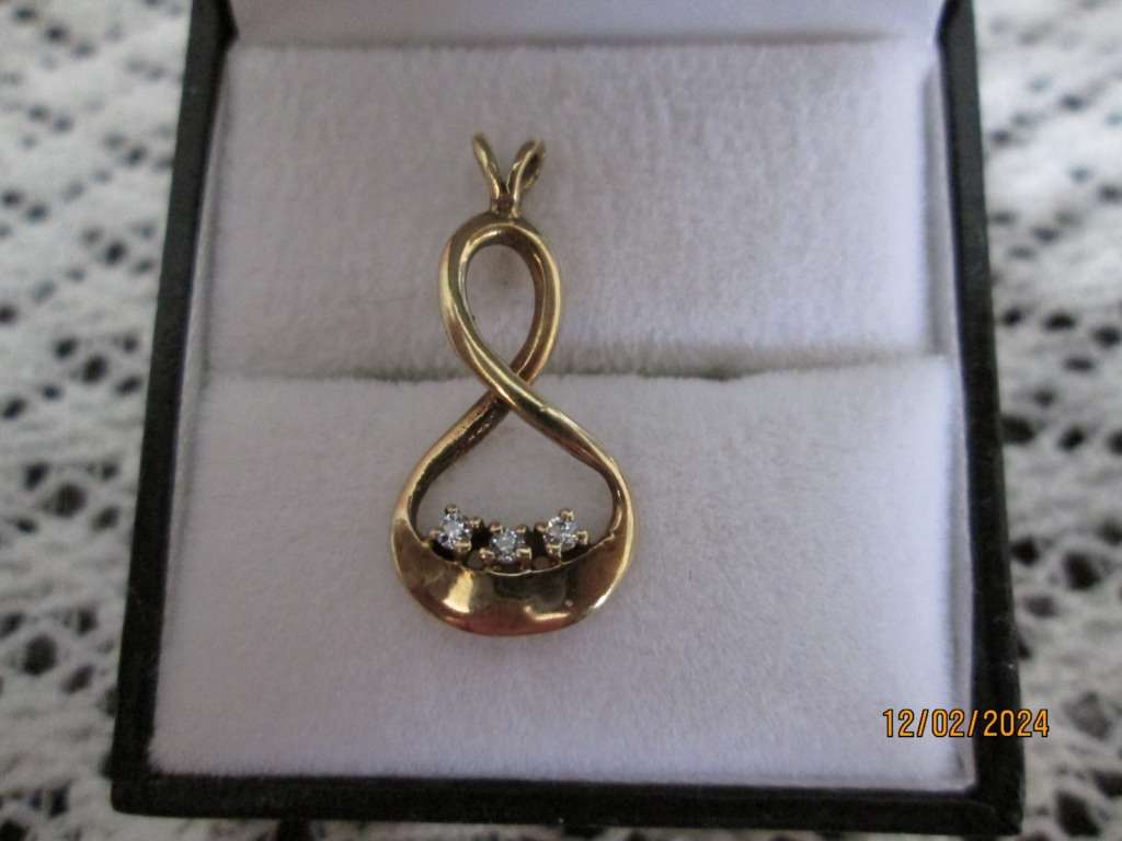 `INFINITY PENDANT` set with 3 X 0.05 Carat Natural Diamonds, set in 9ct Yellow Gold