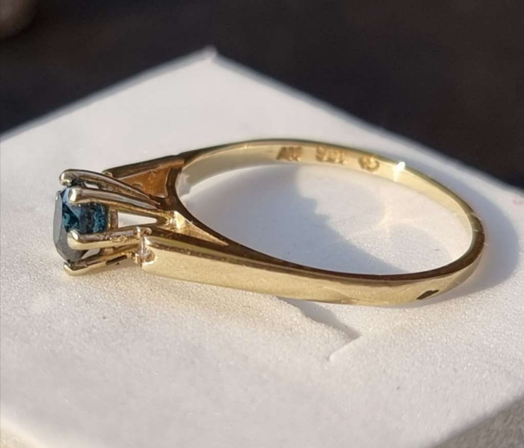 0.56 carat certified fancy blue natural diamond set in 9ct gold