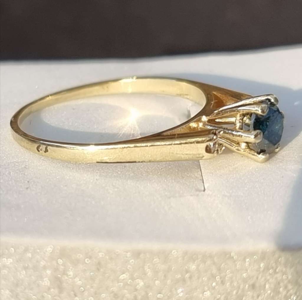 0.56 carat certified fancy blue natural diamond set in 9ct gold