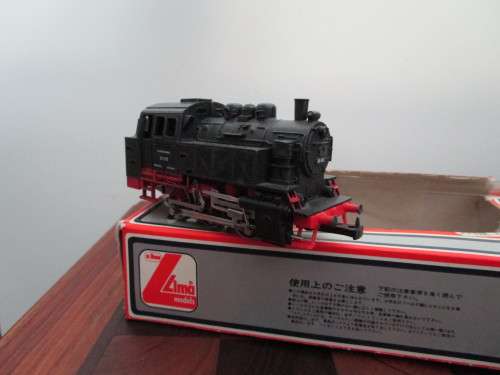 Nine LIMA model trains (two locomotives and seven cars sold as one package + 20 tracks)