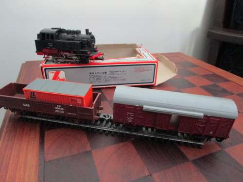 Nine LIMA model trains (two locomotives and seven cars sold as one package + 20 tracks)