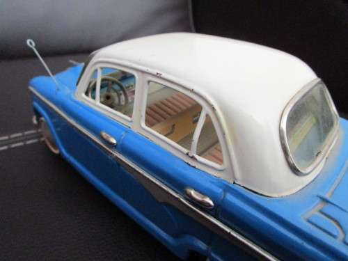 Two model cars - one Shuco Radio 4012 and one Austin model