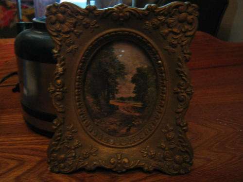 Very old plaster cast pictureframe with pretty print