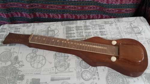 Weird vintage custom made guitar and case.