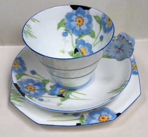 Paragon fine bone china.  Trio for display, because cup has hairline crack on outer lower surface.