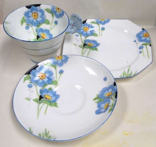 Paragon fine bone china.  Trio for display, because cup has hairline crack on outer lower surface.