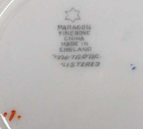 Paragon fine bone china.  Trio for display, because cup has hairline crack on outer lower surface.