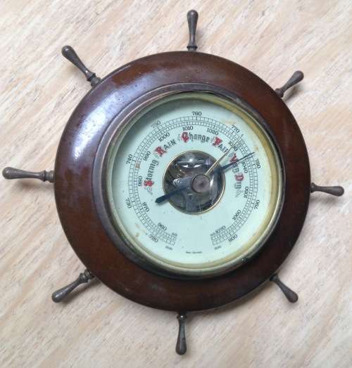 Ship's wheel barometer......accurate with no issues