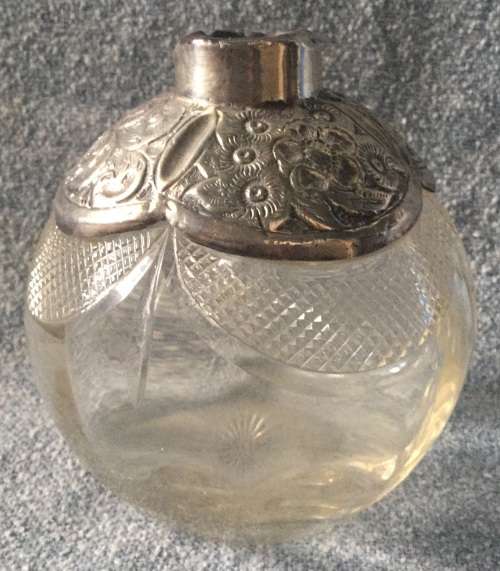 Silver top bottle, damaged, for display as too good to toss out