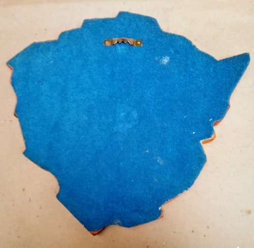 Small wooden plaque ( approx 23 x 25 cms) with 8 Rhodesian badges