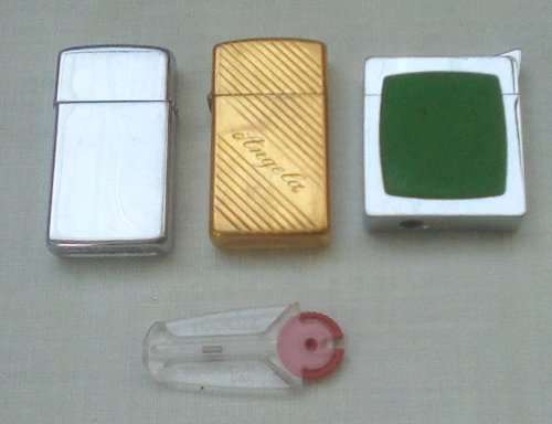 3 x Vintage lighters 2 x Zippo 1 x inscribed `Angela` app. 6 cms long