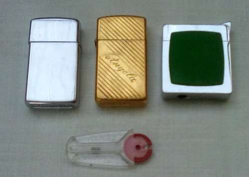 3 x Vintage lighters 2 x Zippo 1 x inscribed `Angela` app. 6 cms long