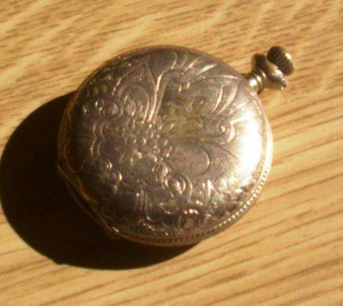 Antique pocket watch and chain