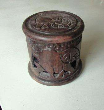 Wooden hand carved coasters x 6 in carved box.Approx. 11cmd x 10cmh
