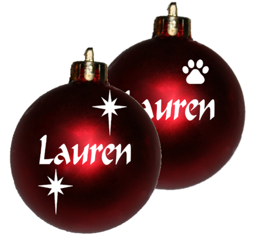 Personalised Christmas baubles each in a white organza bag.