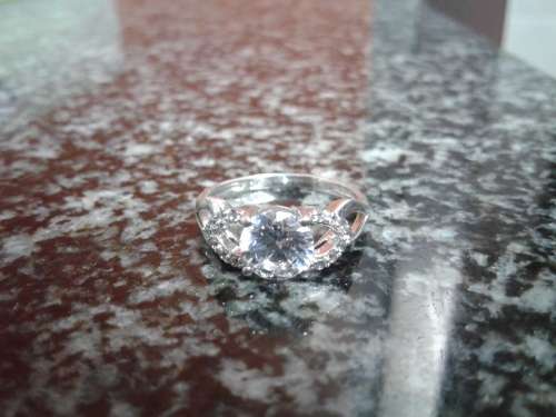 A VINTAGE STERLING SILVER ENGAGEMENT RING SET WITH BEAUTIFUL GEMS