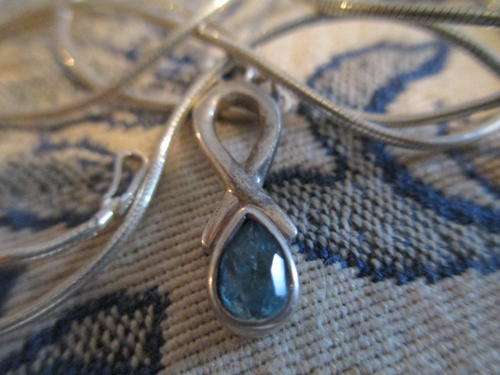 ANTIQUE STERLING SILVER PENDANT  WITH BEAUTIFUL GEM PLUS STERLING SILVER CHAIN.