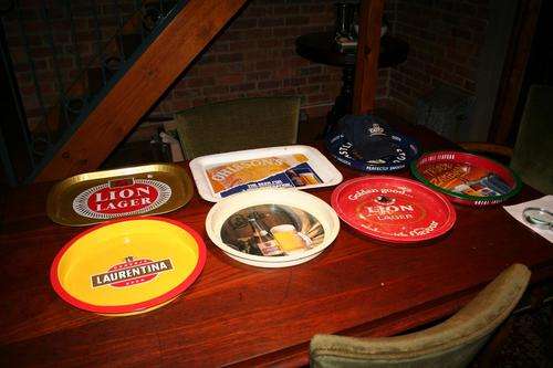 A Great collection of trays/cap - Lion Larger/Old Castle/Hansa/Ohlssons - milk stout etc