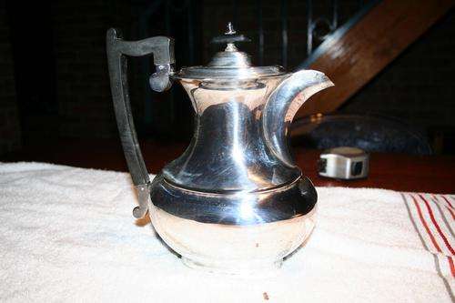 George VI silver plate rectangular hot water jug with plain bulbous body and ebonised handle,Viners