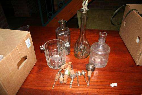 Decanter, 2 Bottles, Ice bucket and an assortment of pourers and wine taps