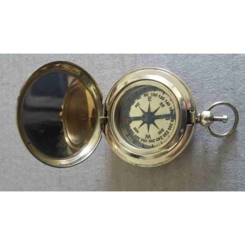 Compass. Push button watch compass solid brass.