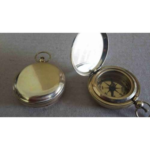 Compass. Push button watch compass solid brass.