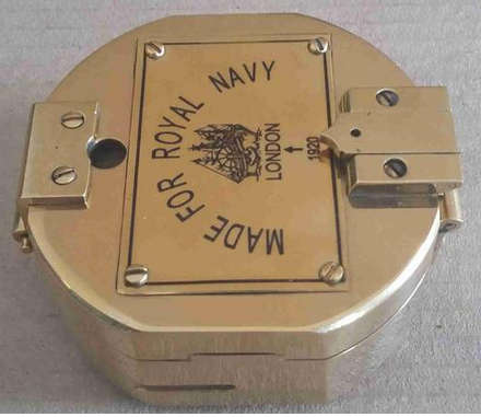 Brunton hexagonal heavy solid brass compass .