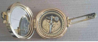 Brunton hexagonal heavy solid brass compass .