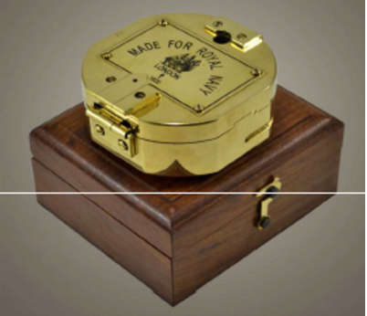 Brunton hexagonal heavy solid brass compass .