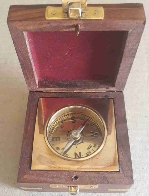Brass Compass fitted in rose wood box.
