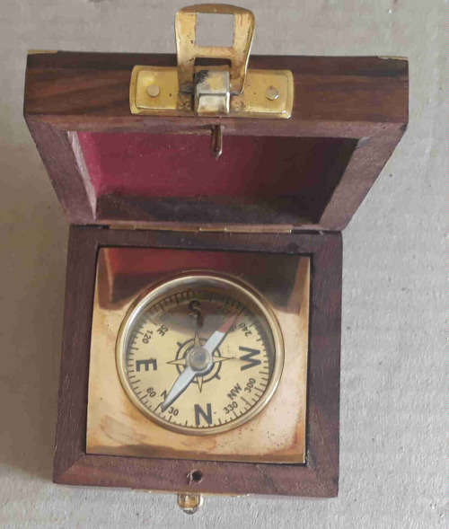 Brass Compass fitted in rose wood box.