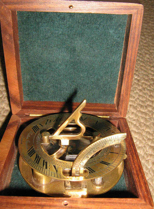 Round sundial compass in wood box
