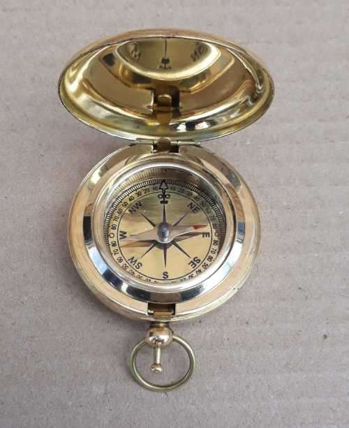 Compass. Push button watch compass solid brass.