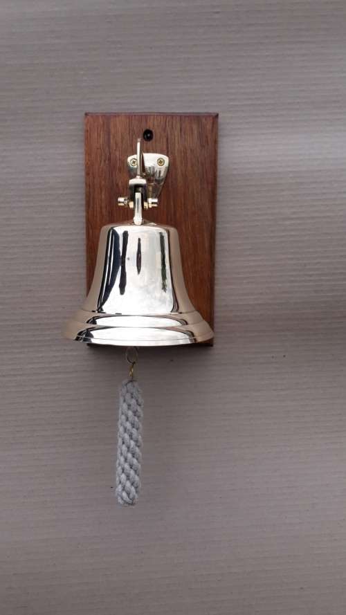 Solid brass ship, motivational bell 14cm diameter, sales bell. Wall mounted on solid wood.