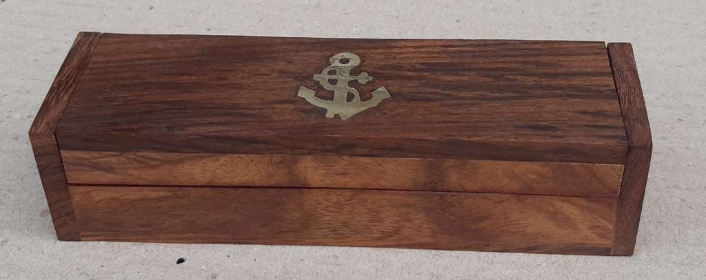 Nautical Boatswain Whistle in a wooden box.
