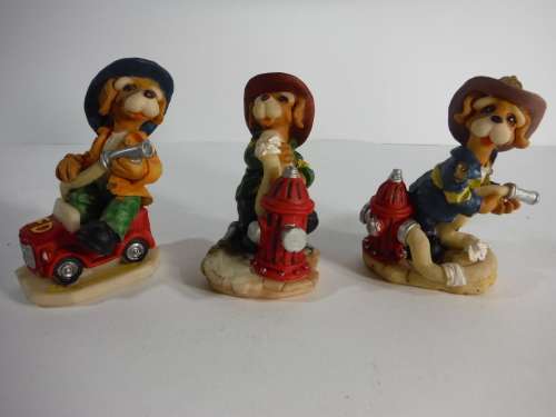Three Fireman Dog Figurines