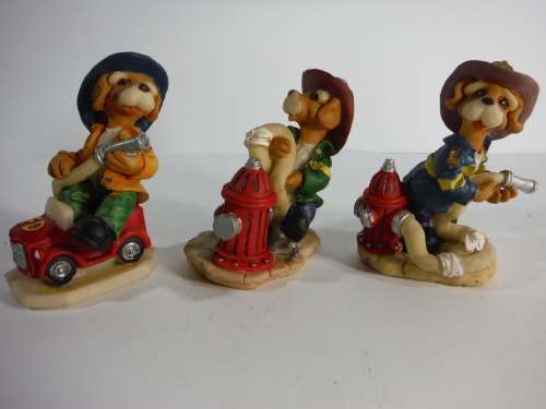 Three Fireman Dog Figurines