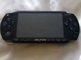 Sony PSP in good condition with pouch, mem card, games & movies