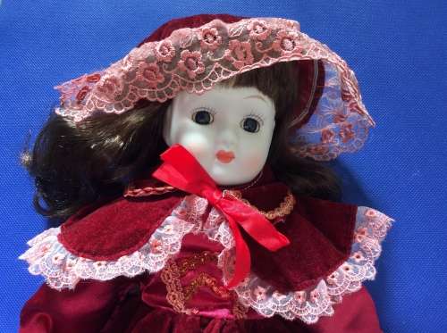 Two Collectable Vintage Porcelain Display Dolls with stands