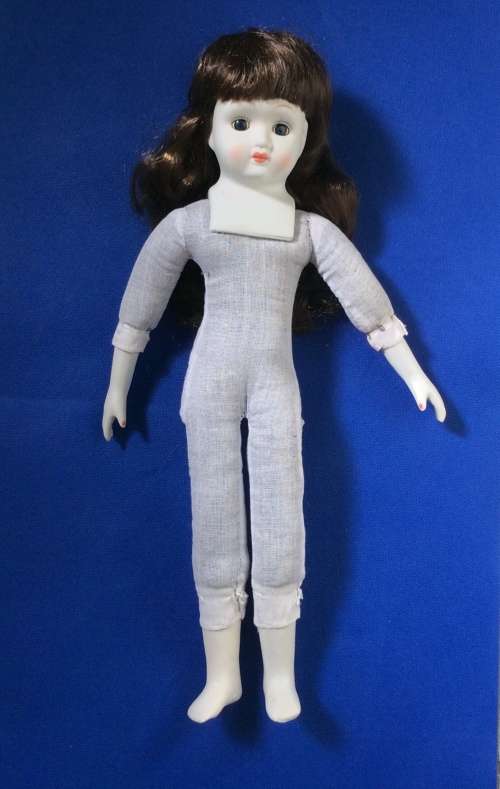 Two Collectable Vintage Porcelain Display Dolls with stands