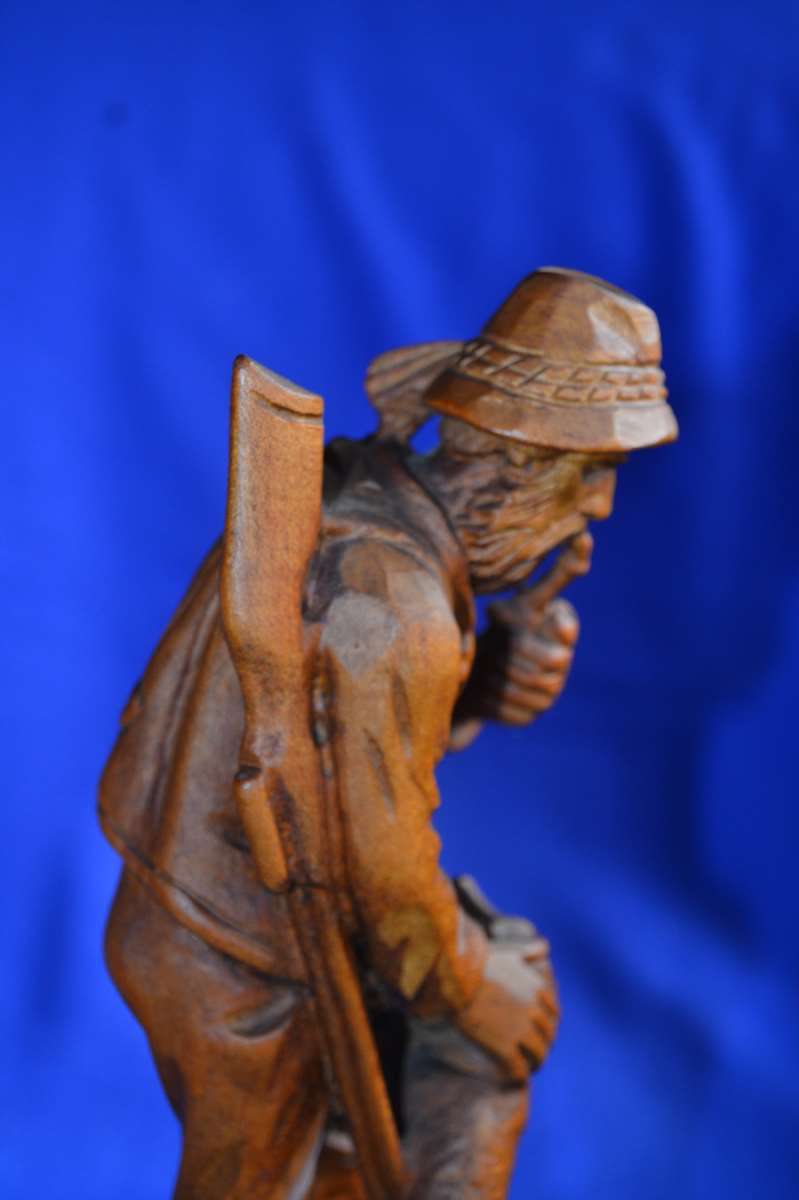 Wooden Carving of a Hunter with his Dog