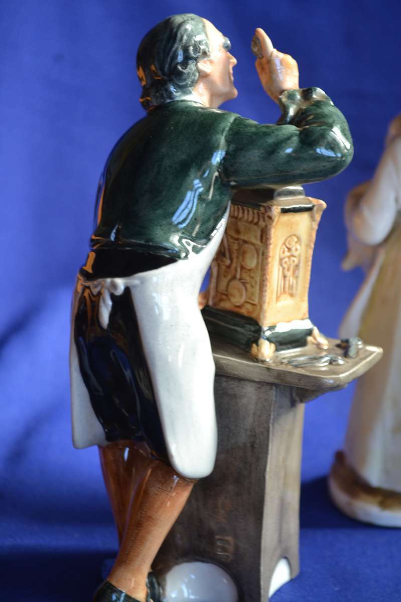 Royal Doulton The Clockmaker with Two Porcelain Figurines (With Repairs)