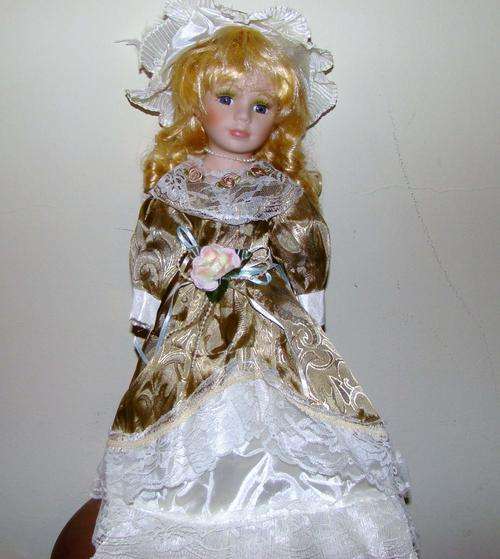 DESIGNER PORCELAIN DOLL WITH GOLD AND LACE DRESS
