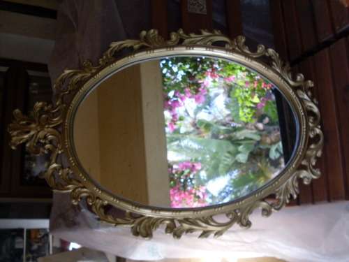 MAGNIFICENT LARGE GILT PIERCED STYLE  LEAF SCROLL FRAMED MIRROR. DEFINTELY SPEAKS VOLUMES