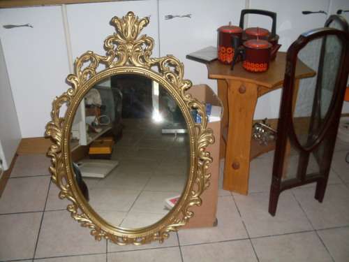 MAGNIFICENT LARGE GILT PIERCED STYLE  LEAF SCROLL FRAMED MIRROR. DEFINTELY SPEAKS VOLUMES